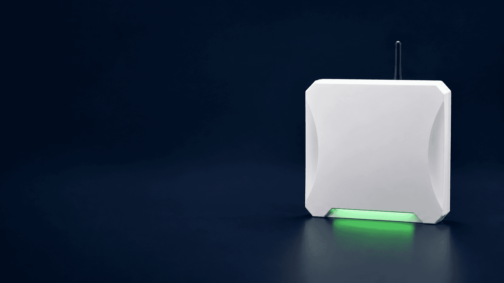 White RFID reader with a green status light.